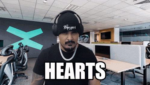 a man wearing headphones and a beanie with the word bazzard on it