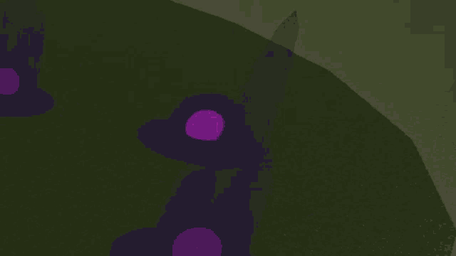 a purple sphere is sitting on top of a grassy hill .