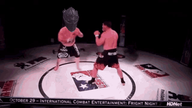 two men are fighting in a boxing ring with the date october 29
