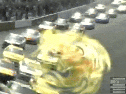a bunch of cars are on a race track with a sign that says ' 90 's commercials ' on the bottom