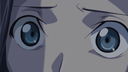 a close up of a person 's eyes that are blue