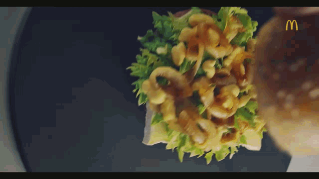 a mcdonald 's advertisement with a sandwich on a plate
