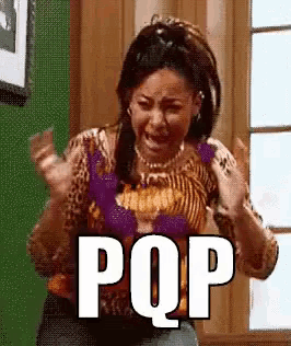 a woman in a leopard print shirt is screaming and holding her hands in the air .