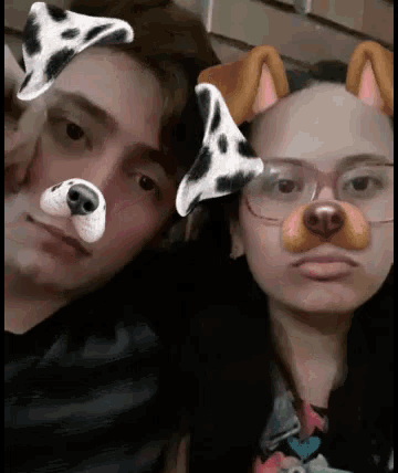 a man and a woman wearing dog face masks