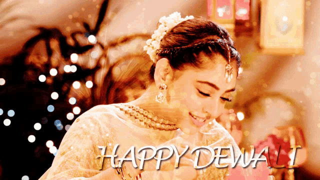 a woman with a flower in her hair and the words happy dewali on the bottom