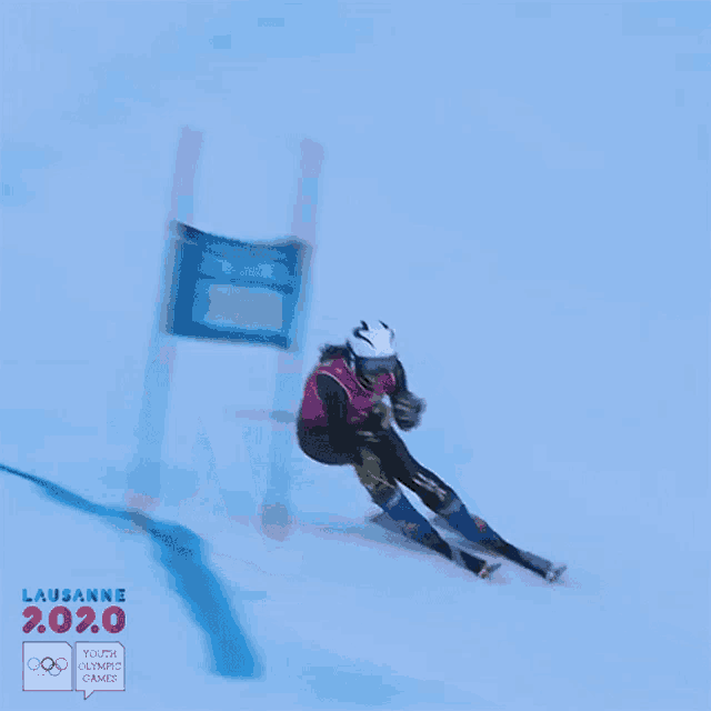 a poster for the lausanne youth olympic games shows a person skiing down a snow covered slope
