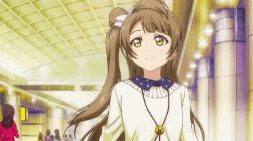 a girl with long brown hair is wearing a white shirt and a necklace .