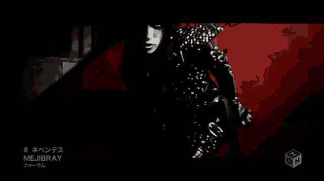 a black and white photo of a woman with mejibray written on the bottom right