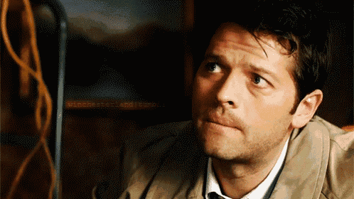 a close up of a man 's face with a serious look on his face