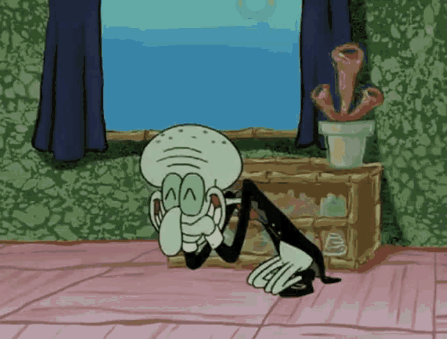 squidward from spongebob squarepants is sitting on the floor in front of a window .