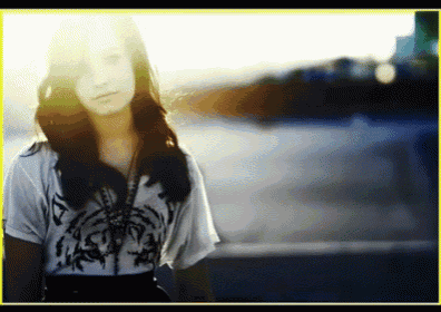 a woman wearing a white shirt with a palm tree design