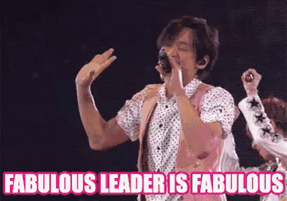a man singing into a microphone with the words fabulous leader is fabulous below him