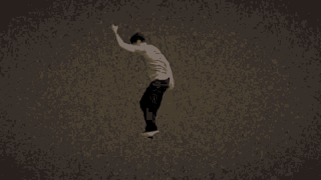 a man is laying on the ground with his arms outstretched .