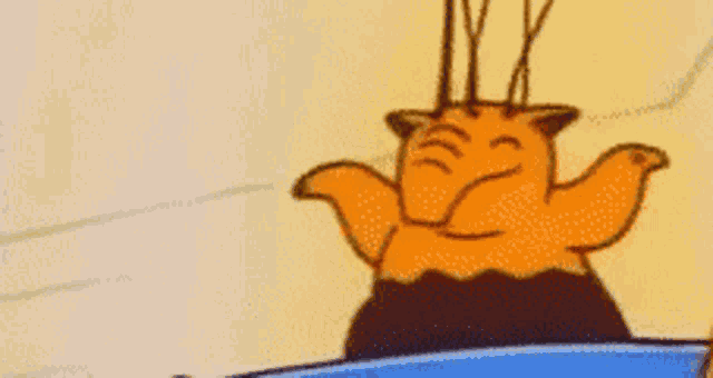 a close up of a cartoon character with horns standing on a boat .