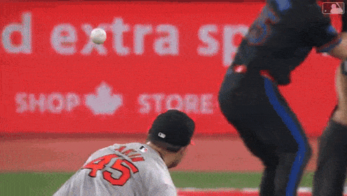 a baseball player with the number 45 on the back of his shirt