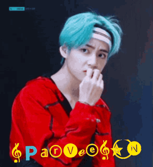 a man with blue hair is wearing a headband and a red shirt