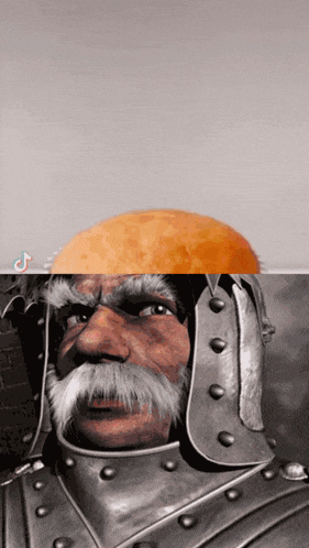 a man with a beard and a helmet has an orange on top