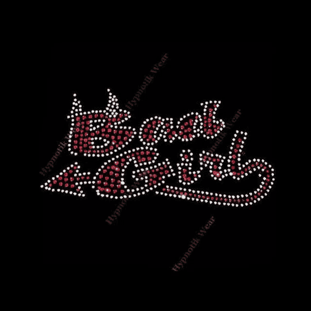 it looks like a devil with a crown on it and the word devil made of red rhinestones on a black background .