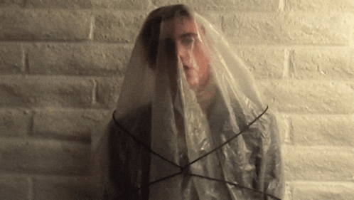 a man with a plastic bag covering his face
