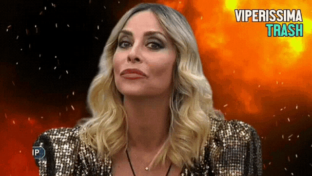 a woman in a sequined jacket with viperissima trash written on the bottom right