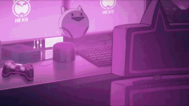 a video game controller sits on a desk with a neko logo on the monitors