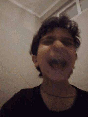 a close up of a person 's face with a blurred background
