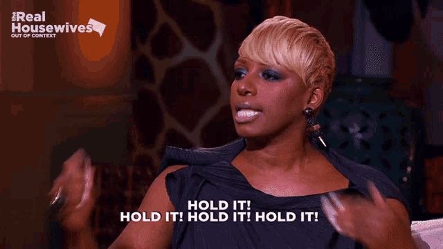 a woman says hold it in front of a real housewives sign