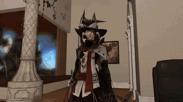 a woman in a witch costume stands in front of a wall with butterflies on it