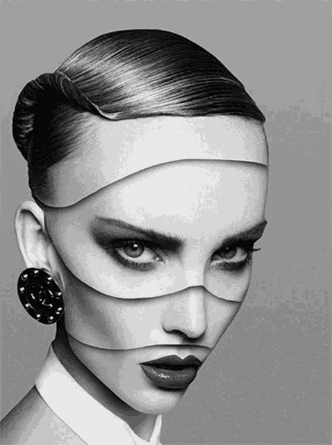 a black and white photo of a woman 's face