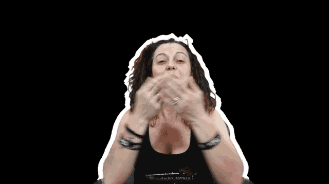 a woman wearing a black tank top with a white outline around her head