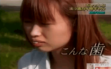 a close up of a woman 's face with chinese writing on the bottom right