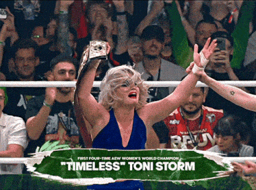 a woman in a blue dress is holding a trophy that says timeless on it