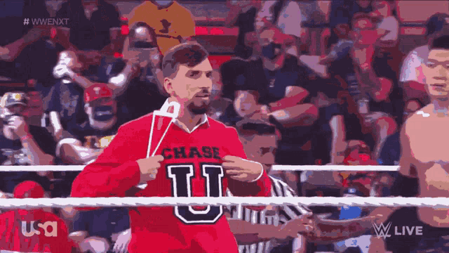 a man wearing a red shirt that says chase u on it