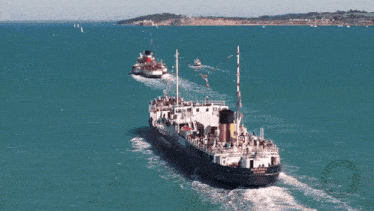 two ships in the ocean one of which has the name king george on it