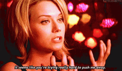 a woman in a black dress says it seems like you 're trying really hard to push me away