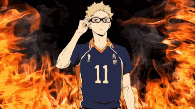 a man wearing glasses and a jersey with the number 11