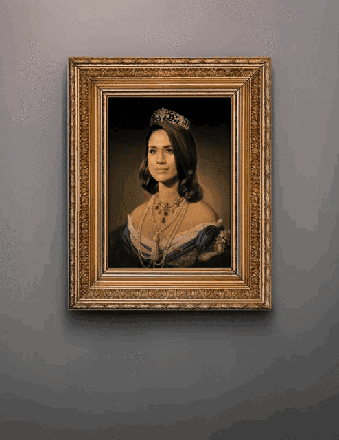 a framed picture of a woman wearing a tiara and pearls