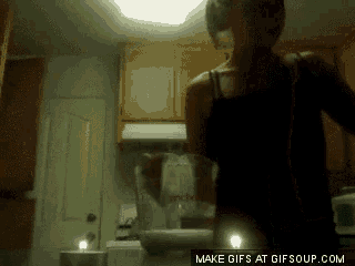 a woman is pouring something into a measuring cup with the words make gifs at gifsoup.com
