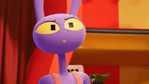 a purple cartoon character with yellow eyes is standing in front of a red curtain .