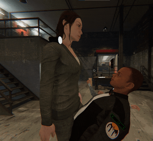 a woman in a suit stands next to a man in a black jacket with a patch on it that says ' a '