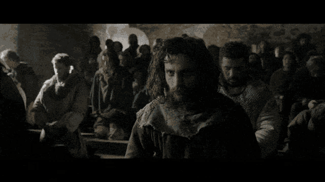 a group of people sitting in a dark room with the words douglaaaas written above them