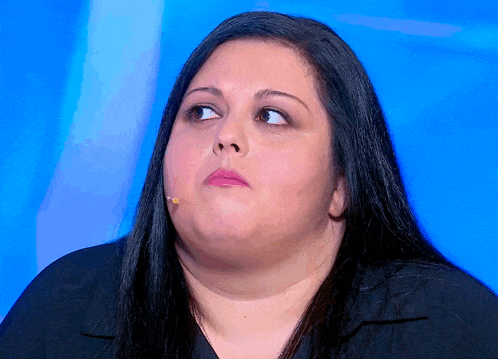 a woman with a microphone in her mouth is looking up