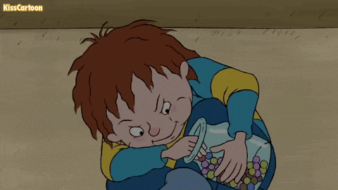 a cartoon of a boy holding a jar of candy with kisscartoon written on the bottom right