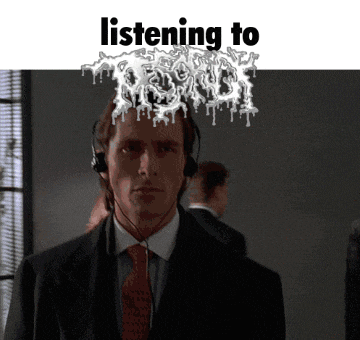 a man in a suit and tie is listening to a band