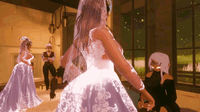 a woman in a wedding dress is standing in a room with two other women