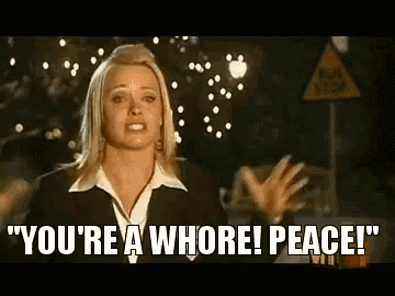 a woman in a suit says you 're a whore peace .