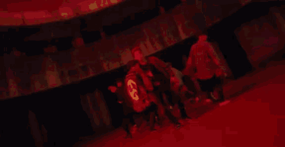 a large fire is burning in a dark room in a dark room .