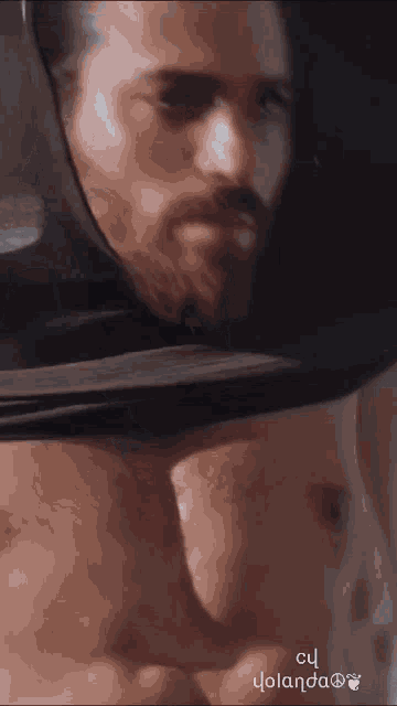 a close up of a man 's chest with the words cu yolanda on the bottom right
