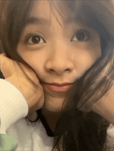 a close up of a woman making a funny face