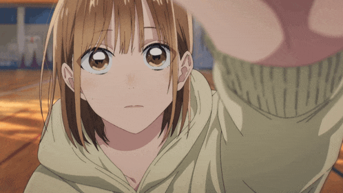 a close up of a girl 's face with a sweater that says ' nnm ' on it